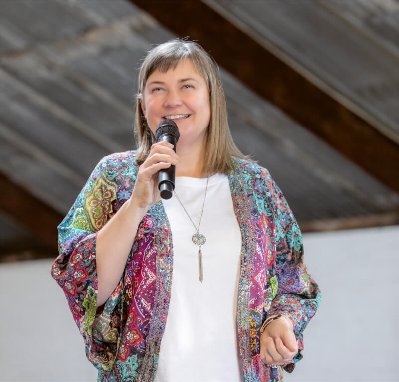 Jodie Willmer speaking with a microphone